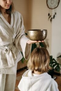 Mental health care. headache Sound healing with singing bowls. meditating