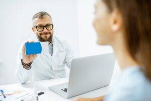 Senior doctor offering some medicine